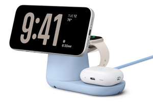 Belkin UltraCharge Pro 3-in-1 Magnetic Charging Dock, front exterior, blue color, iPhone charging on top in landscape orientation, Apple Watch charging at back, and AirPods case charging at bottom right