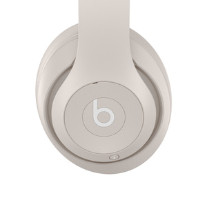 Beats Studio Pro Wireless Headphones in Sandstone, with multi-function on-ear controls.