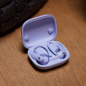 Powerbeats Pro 2 earbuds inserted into charging case.