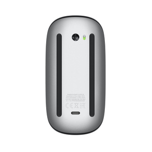 Magic Mouse bottom, silver aluminium bottom with sensor at the top and USB-C port for charging near the bottom. Black Apple logo in the centre