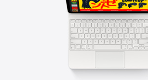 iPad Air attached to Magic Keyboard, top exterior, white color, built-in trackpad