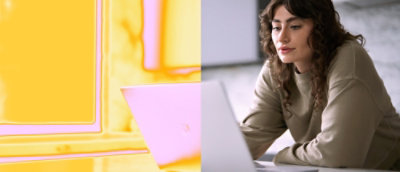 A woman looking at a laptop.