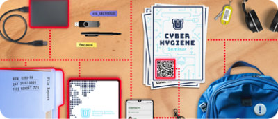 Workspace with cyber hygiene seminar materials, file reports, digital devices, and a blue backpack on a desk.